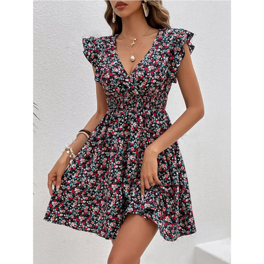 Woman wearing a floral dress against a light background